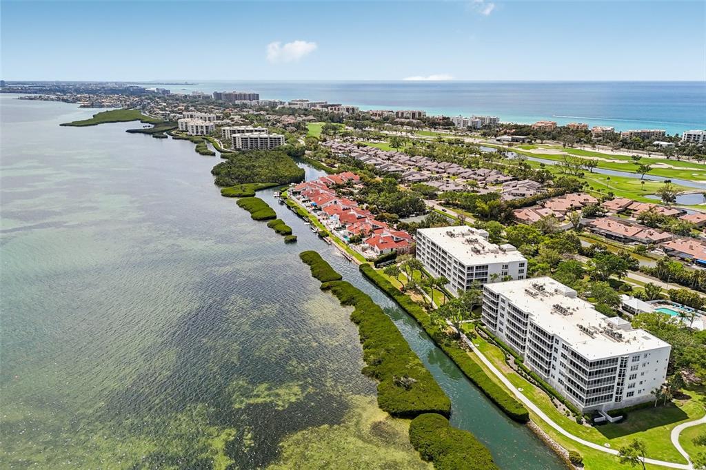 2450 Harbourside Drive, Unit 244 Longboat Key, FL 34228 - Photo 35 of 46 an aerial view of residential building and lake view
