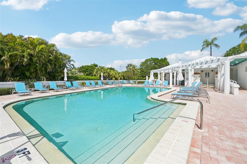 2450 Harbourside Drive, Unit 244 Longboat Key, FL 34228 - Photo 37 of 46 a view of a swimming pool with a lawn chairs
