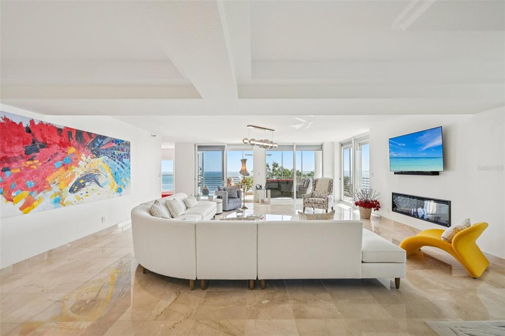 2450 Harbourside Drive, Unit 244 Longboat Key, FL 34228 - Photo 4 of 46 a living room with furniture and a couch