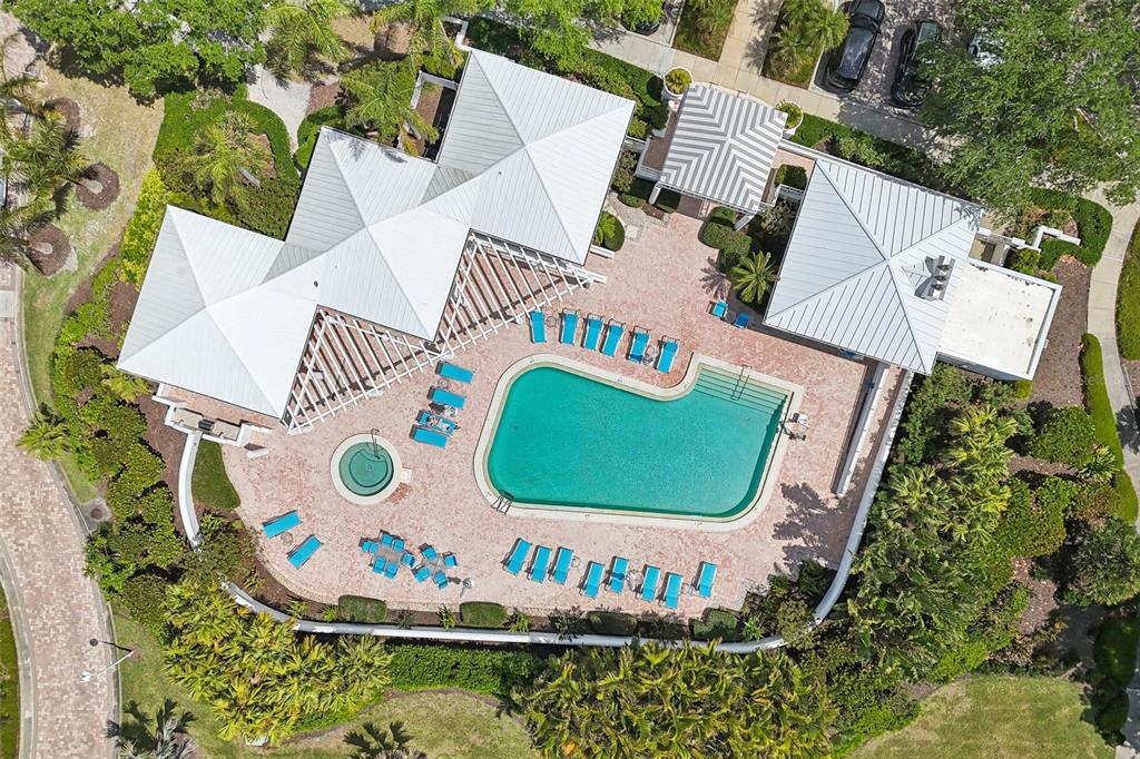 2450 Harbourside Drive, Unit 244 Longboat Key, FL 34228 - Photo 41 of 46 an aerial view of a house with a swimming pool and outdoor seating