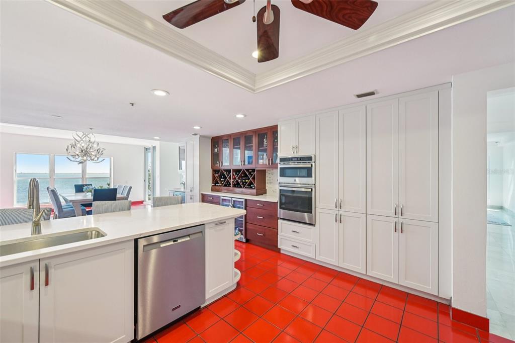 2450 Harbourside Drive, Unit 244 Longboat Key, FL 34228 - Photo 8 of 46 a open kitchen with stainless steel appliances granite countertop a stove and cabinets