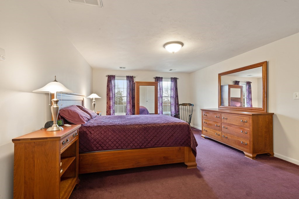 246 Morgan Road Whitinsville, MA 01588 - Photo 15 of 28 a bedroom with a bed and a dresser