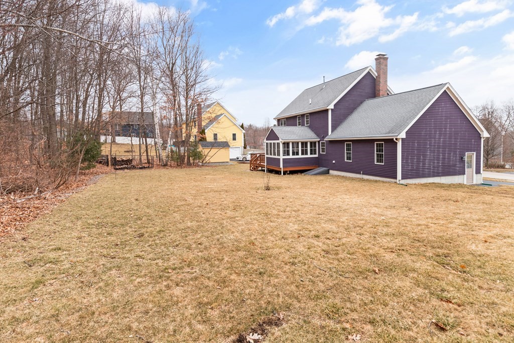 246 Morgan Road Whitinsville, MA 01588 - Photo 28 of 28 a view of a house with a yard covered in snow