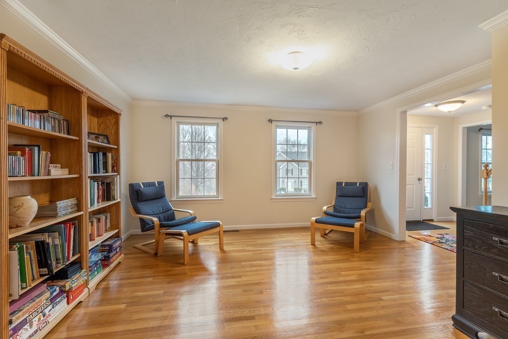 246 Morgan Road Whitinsville, MA 01588 - Photo 4 of 28 a living room with furniture and a book shelf