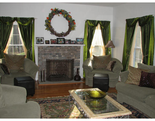12 Buffy Road Bellingham, MA 02019 - Photo 4 of 15 a living room with furniture a fireplace and decor