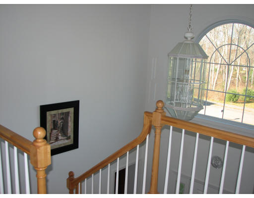 12 Buffy Road Bellingham, MA 02019 - Photo 8 of 15 a view of a hallway with wooden floor and a small yard