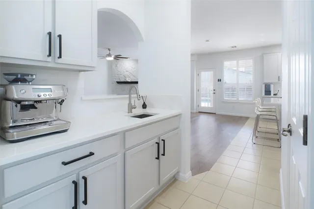 a kitchen with cabinets and window