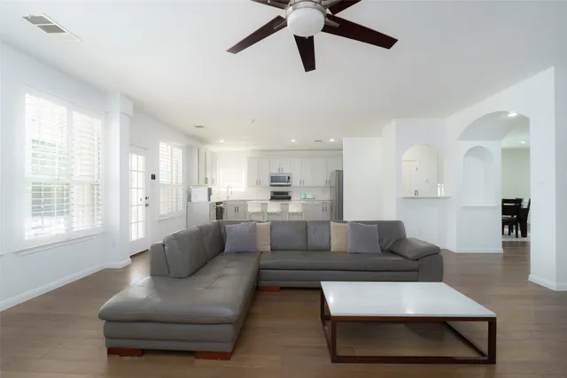 a living room with furniture and a large window