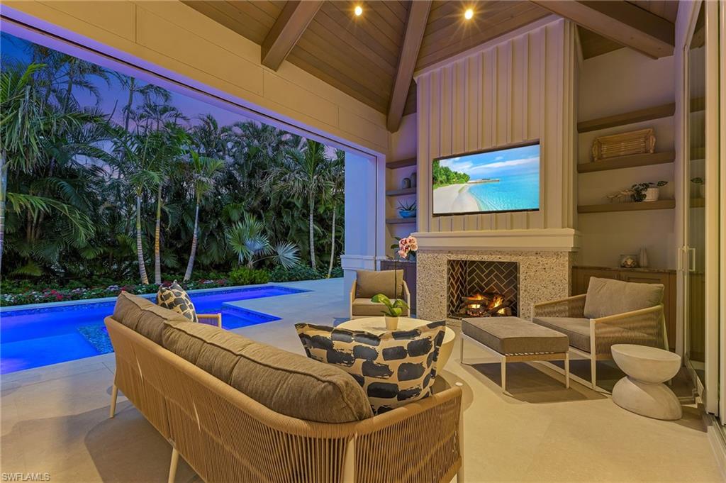 509 Turtle Hatch Road Naples, FL 34103 - Photo 35 of 38 Covered Lanai at Dusk