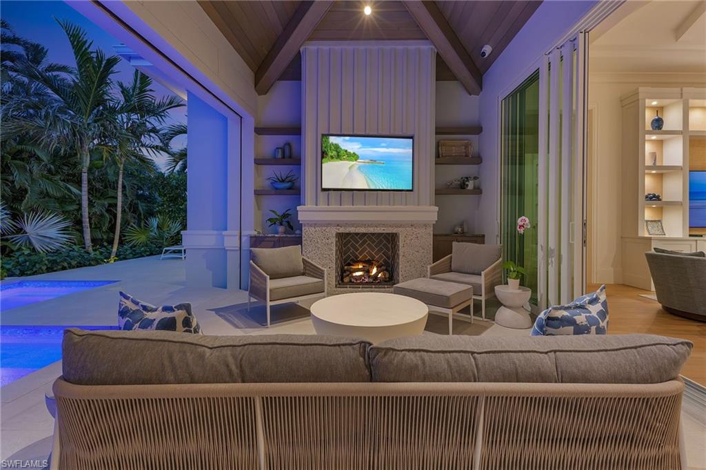 509 Turtle Hatch Road Naples, FL 34103 - Photo 37 of 38 Covered Lanai at Dusk