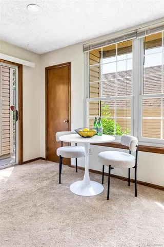 a work room with furniture and a window