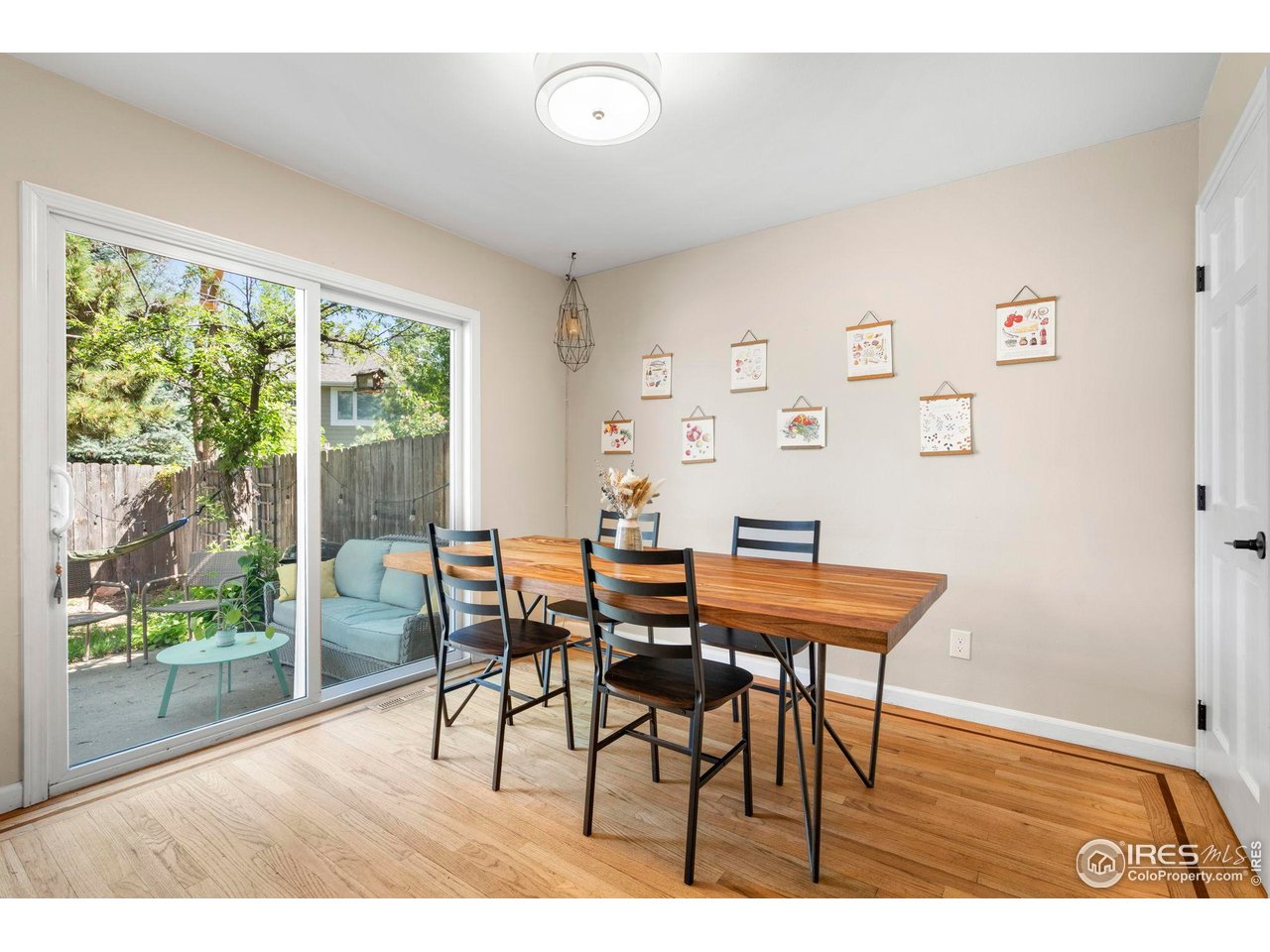 3878 Broadway, Unit 1 Boulder, CO 80304 - Photo 11 of 36 a view of a dining room with furniture and wooden floor