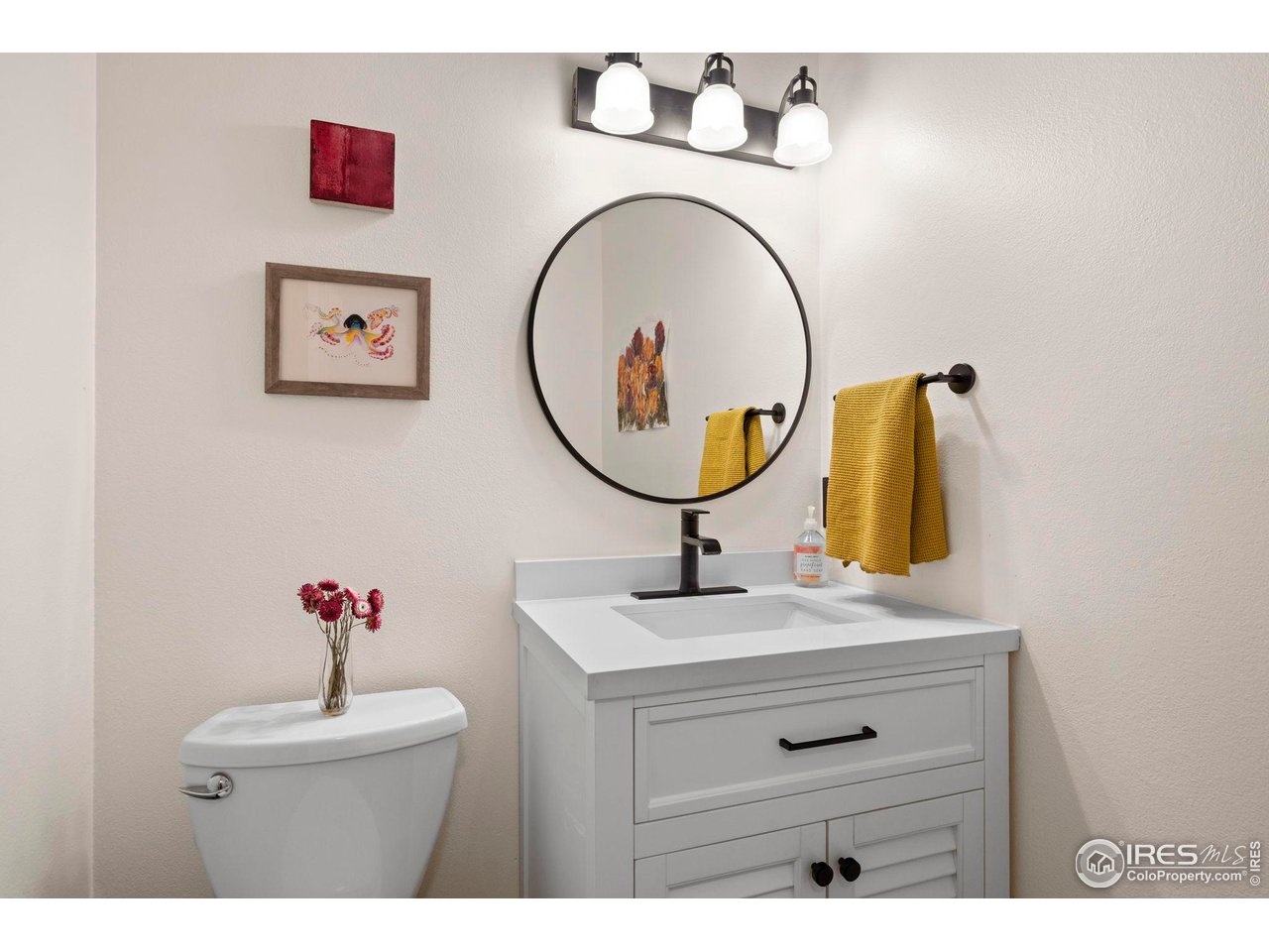 3878 Broadway, Unit 1 Boulder, CO 80304 - Photo 12 of 36 a bathroom with a sink mirror and vanity