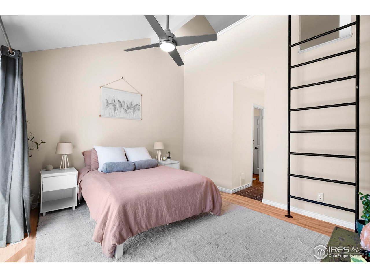 3878 Broadway, Unit 1 Boulder, CO 80304 - Photo 13 of 36 a bedroom with a bed and a walk in closet