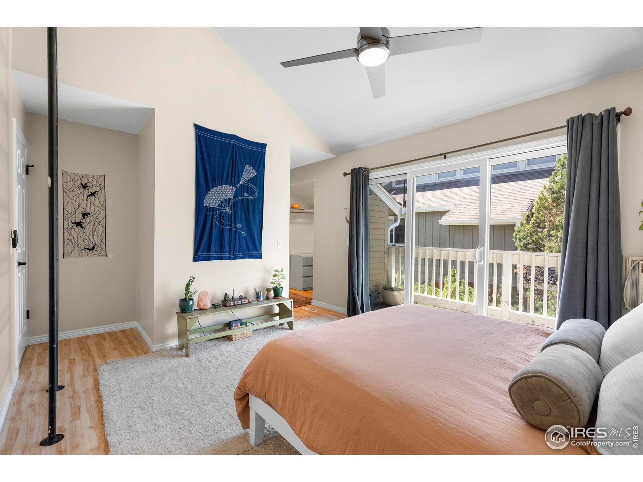 3878 Broadway, Unit 1 Boulder, CO 80304 - Photo 14 of 36 a bedroom with a bed and a large window