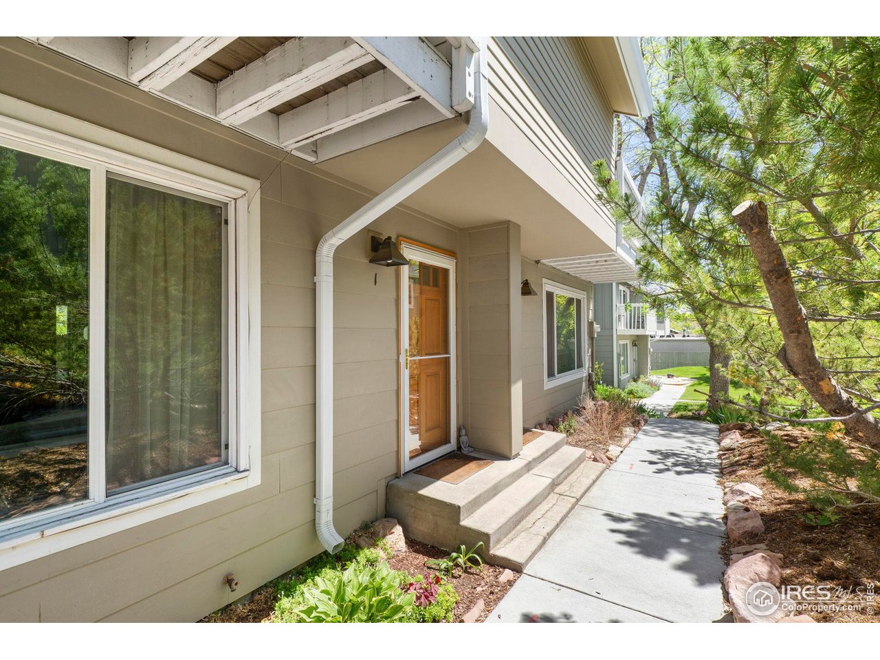 3878 Broadway, Unit 1 Boulder, CO 80304 - Photo 2 of 36 a view of a house with a backyard