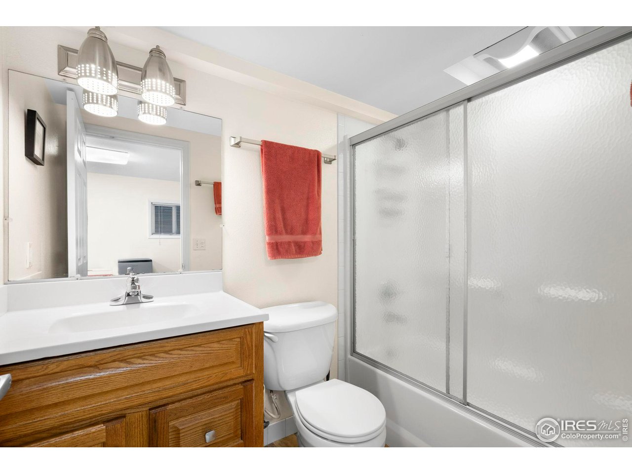 3878 Broadway, Unit 1 Boulder, CO 80304 - Photo 23 of 36 a bathroom with a sink a toilet and shower