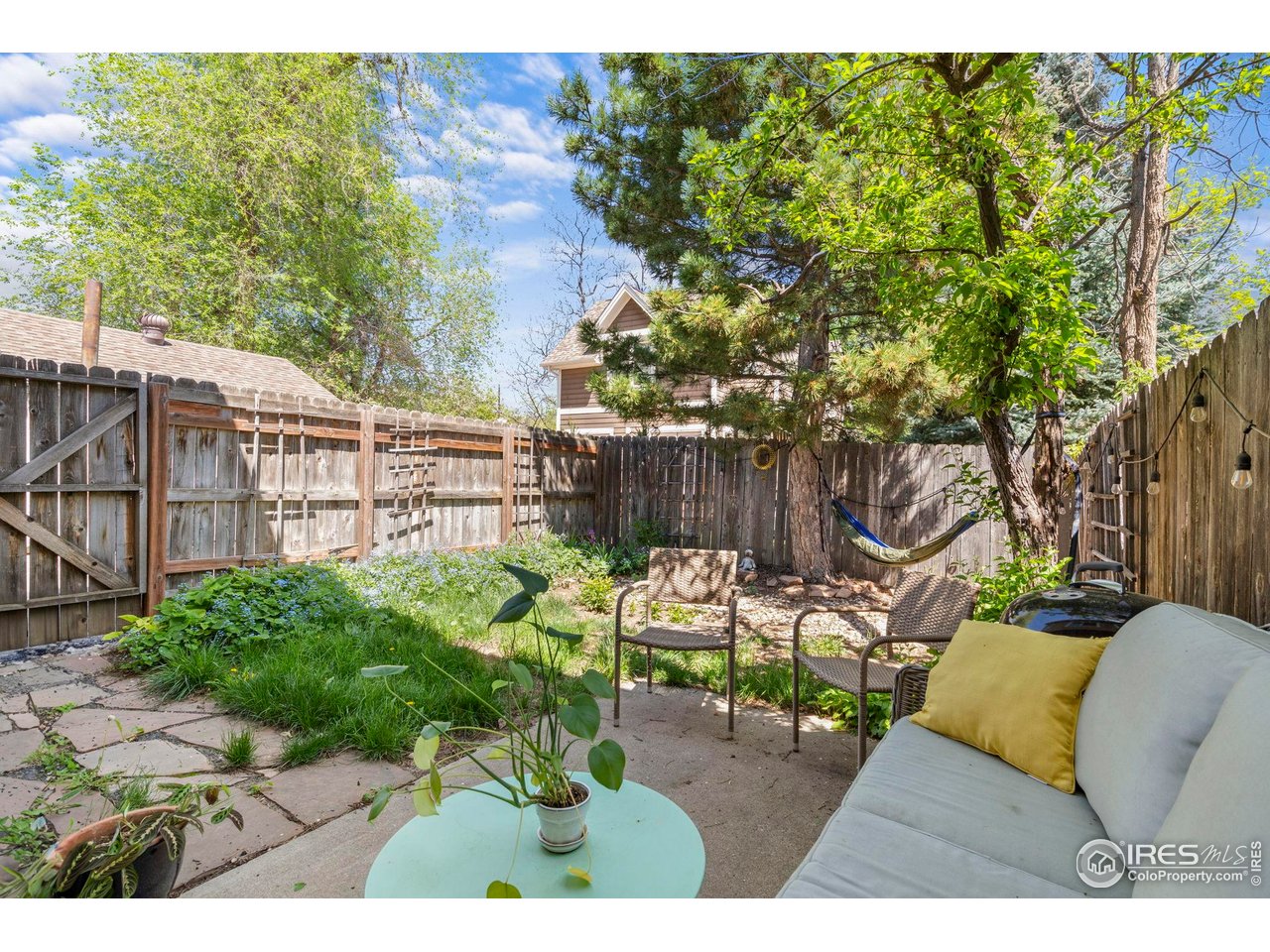 3878 Broadway, Unit 1 Boulder, CO 80304 - Photo 27 of 36 a view of a patio with table and chairs and potted plants