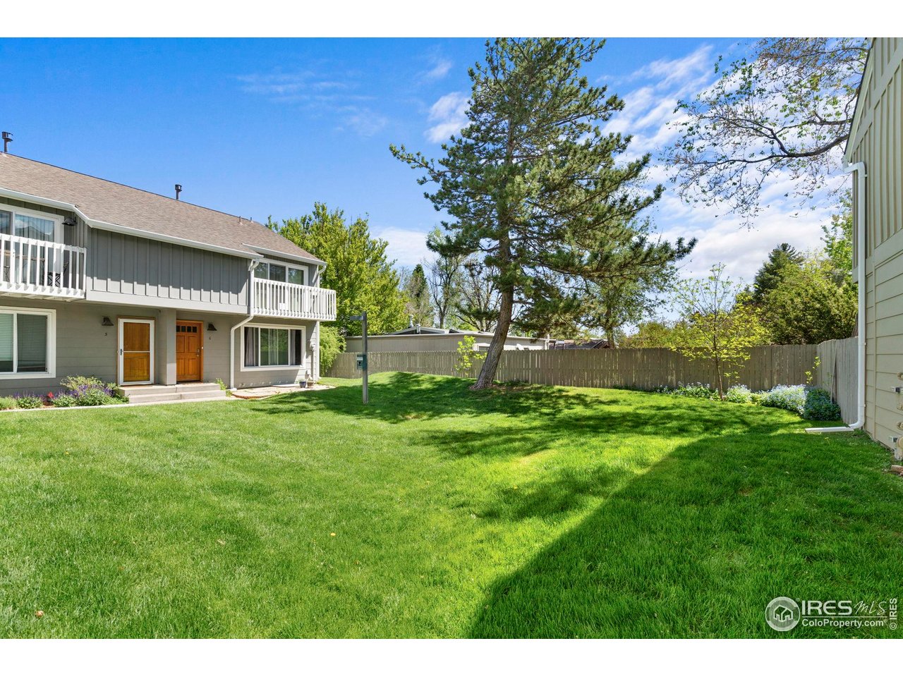 3878 Broadway, Unit 1 Boulder, CO 80304 - Photo 31 of 36 a view of a yard with a house in the background