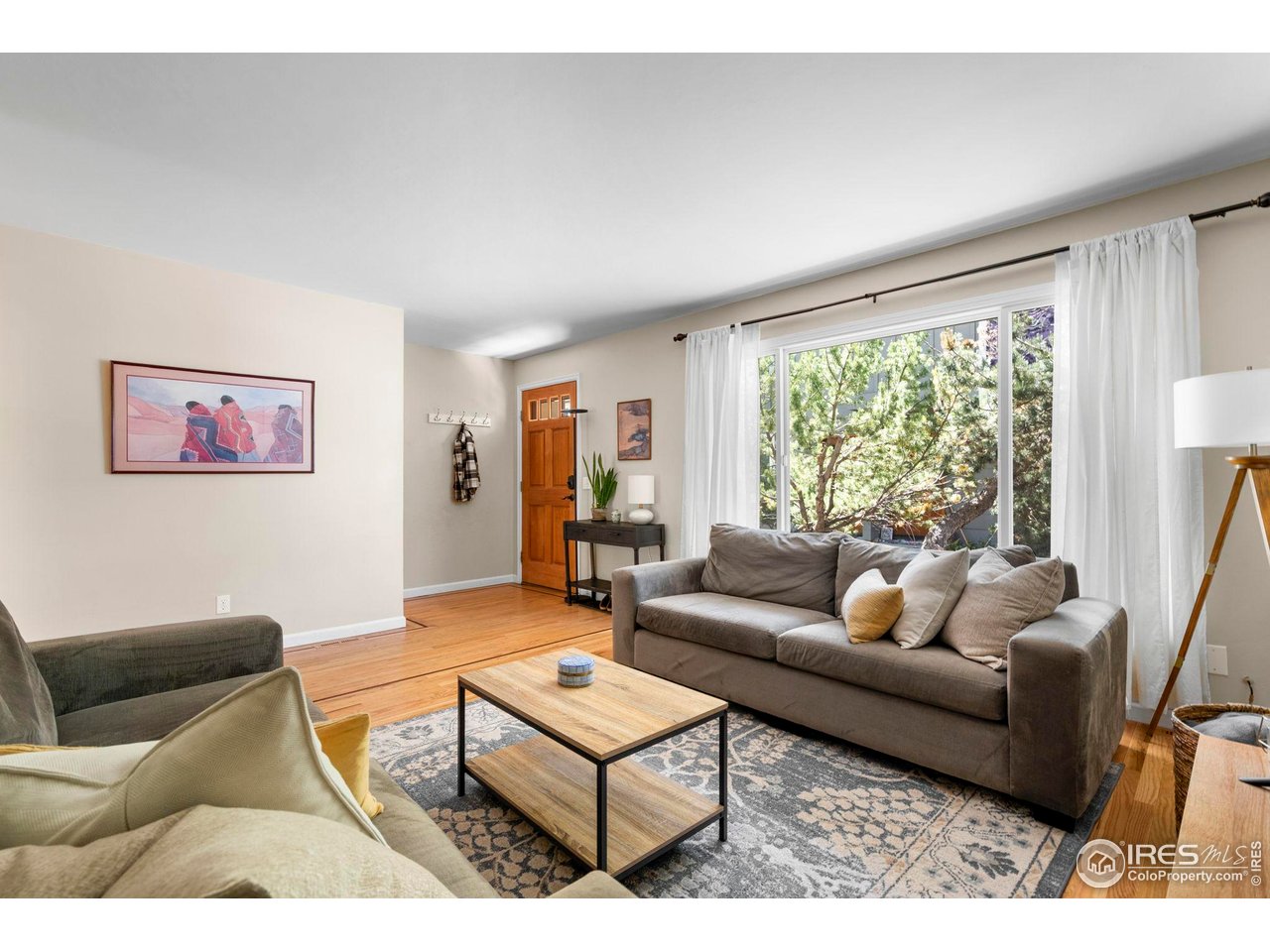 3878 Broadway, Unit 1 Boulder, CO 80304 - Photo 5 of 36 a living room with furniture and a large window