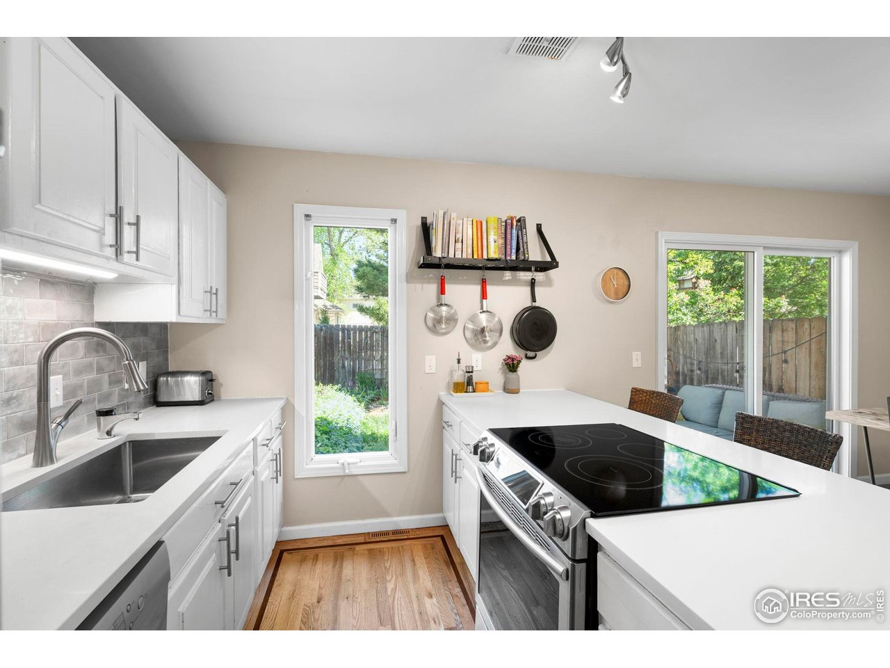 3878 Broadway, Unit 1 Boulder, CO 80304 - Photo 8 of 36 a kitchen that has a sink and a stove