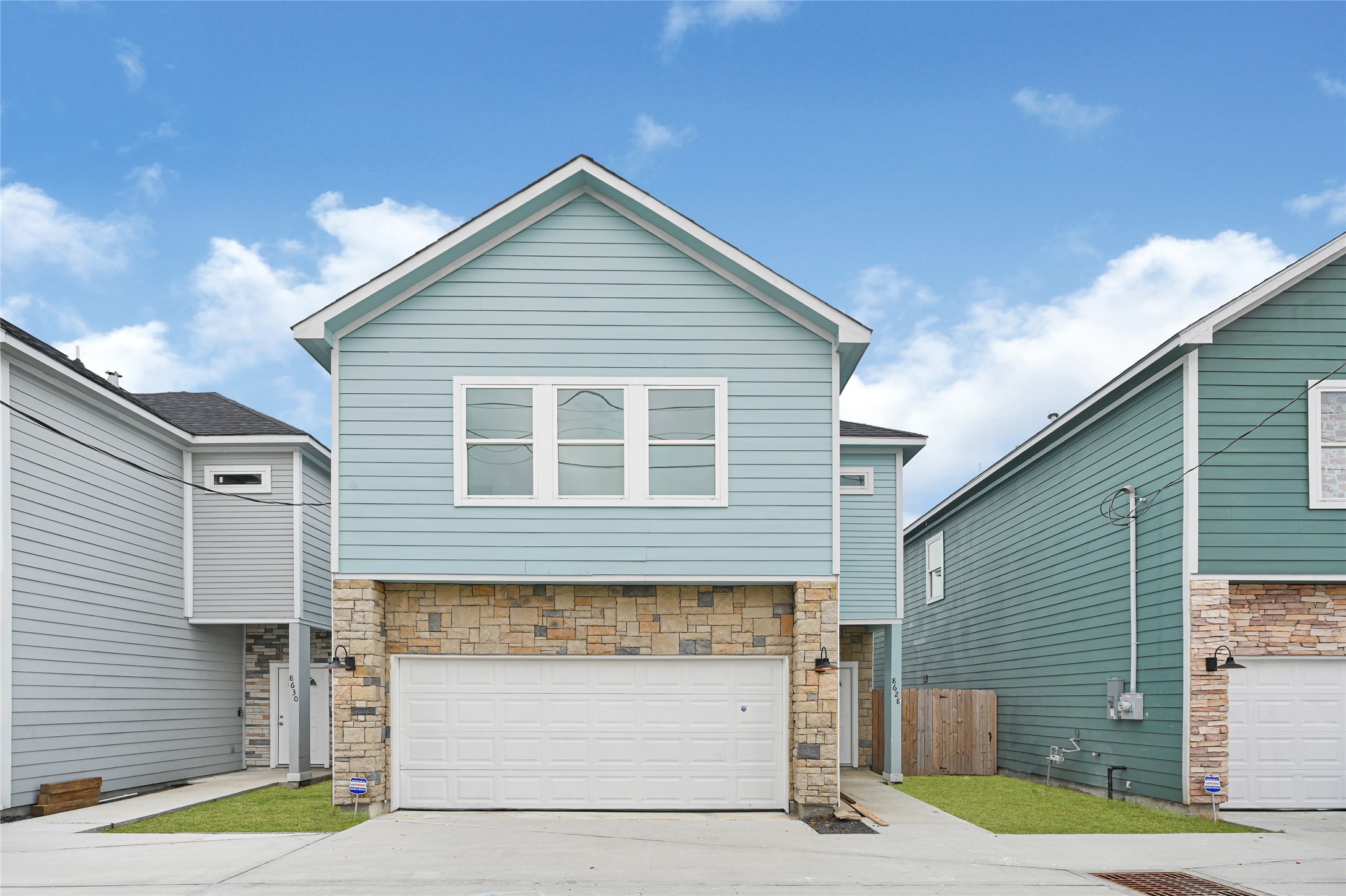 a front view of a house with a garage