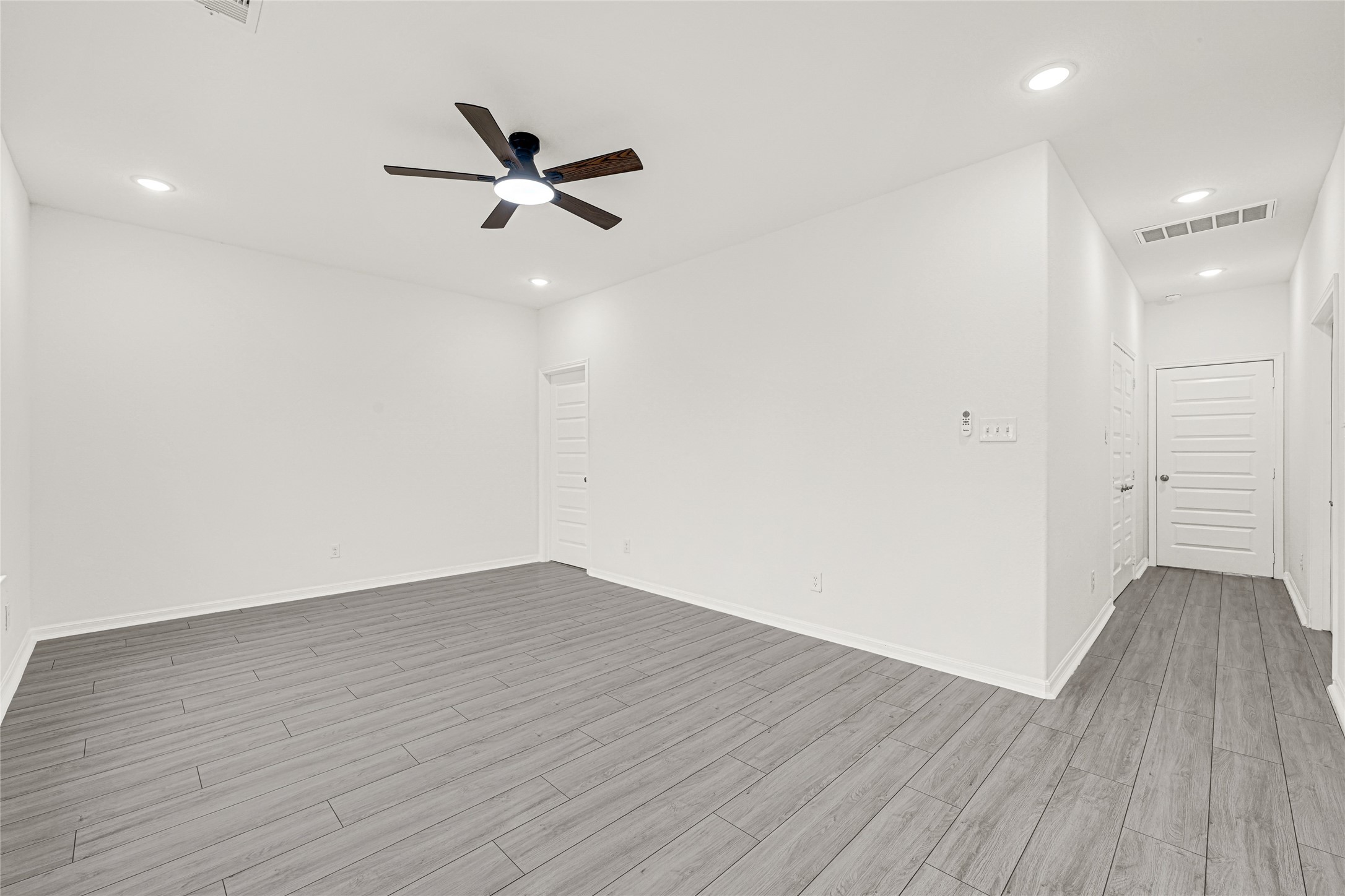 8628 Scott Street Houston, TX 77051 - Photo 12 of 22 wooden floor in an empty room with a window
