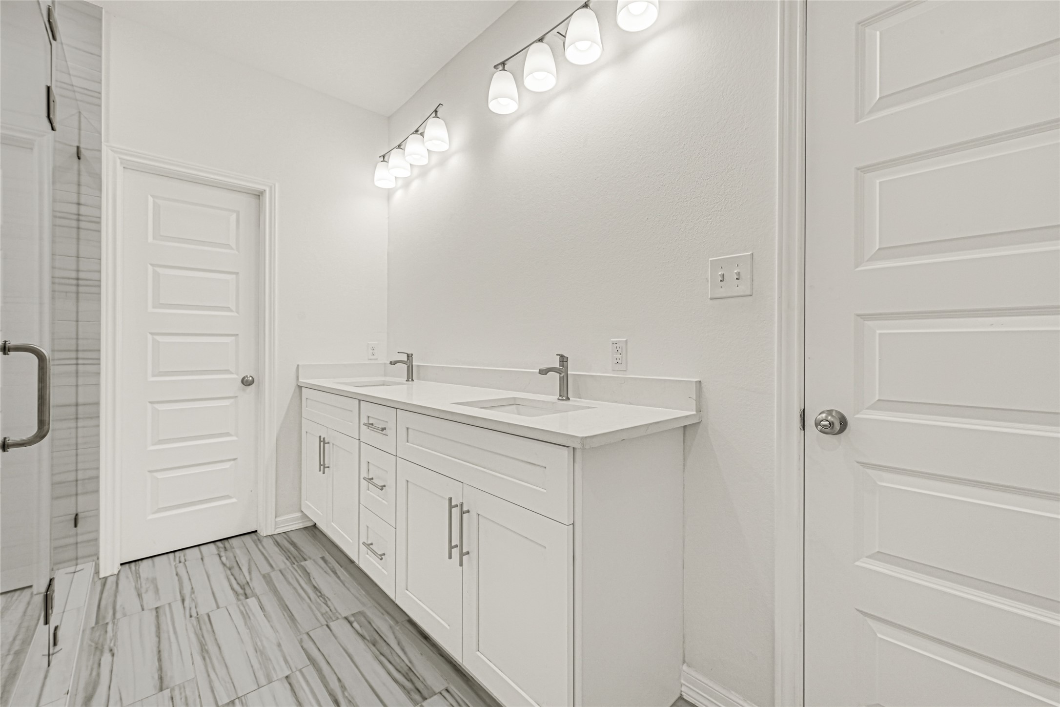 8628 Scott Street Houston, TX 77051 - Photo 14 of 22 a bathroom with a double vanity sink and mirror
