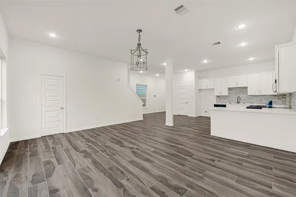 a view of a house with a yard and garage