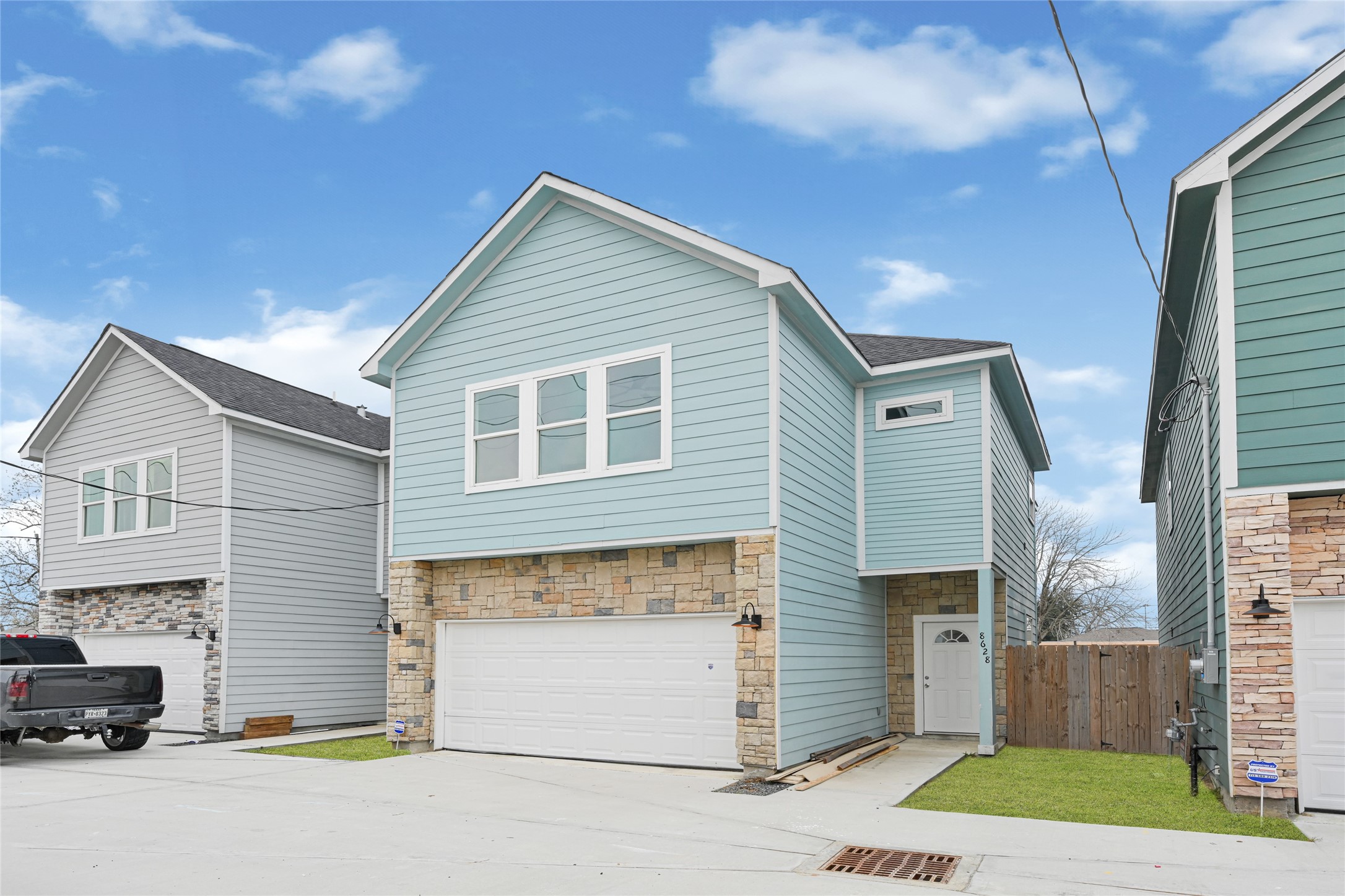 8628 Scott Street Houston, TX 77051 - Photo 8 of 22 a view of a house with a yard and garage