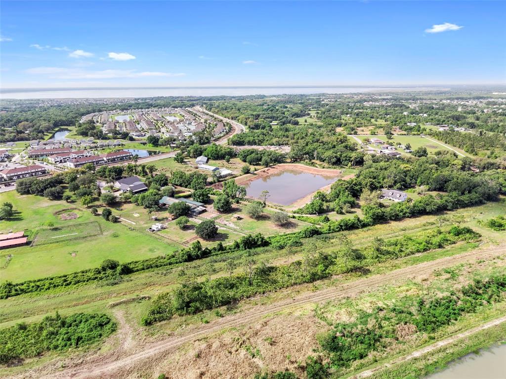4385 Boggy Creek Road Kissimmee, FL 34744 - Photo 19 of 23 an aerial view of residential houses with outdoor space and trees