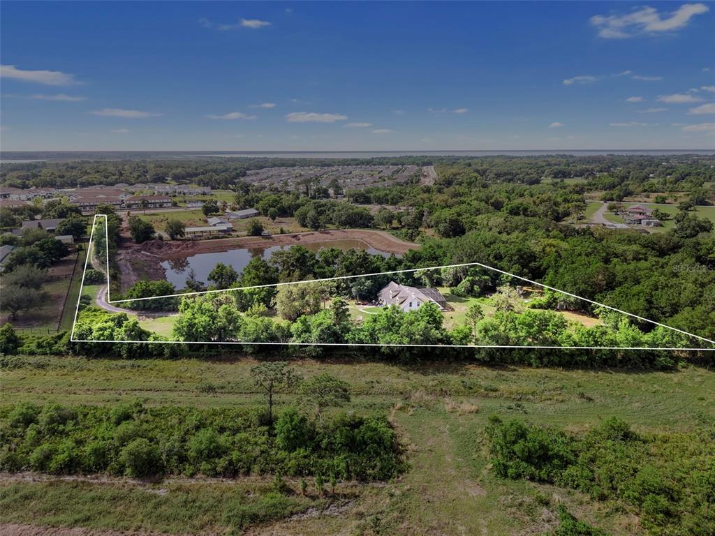 4385 Boggy Creek Road Kissimmee, FL 34744 - Photo 3 of 23 an aerial view of a house with a yard