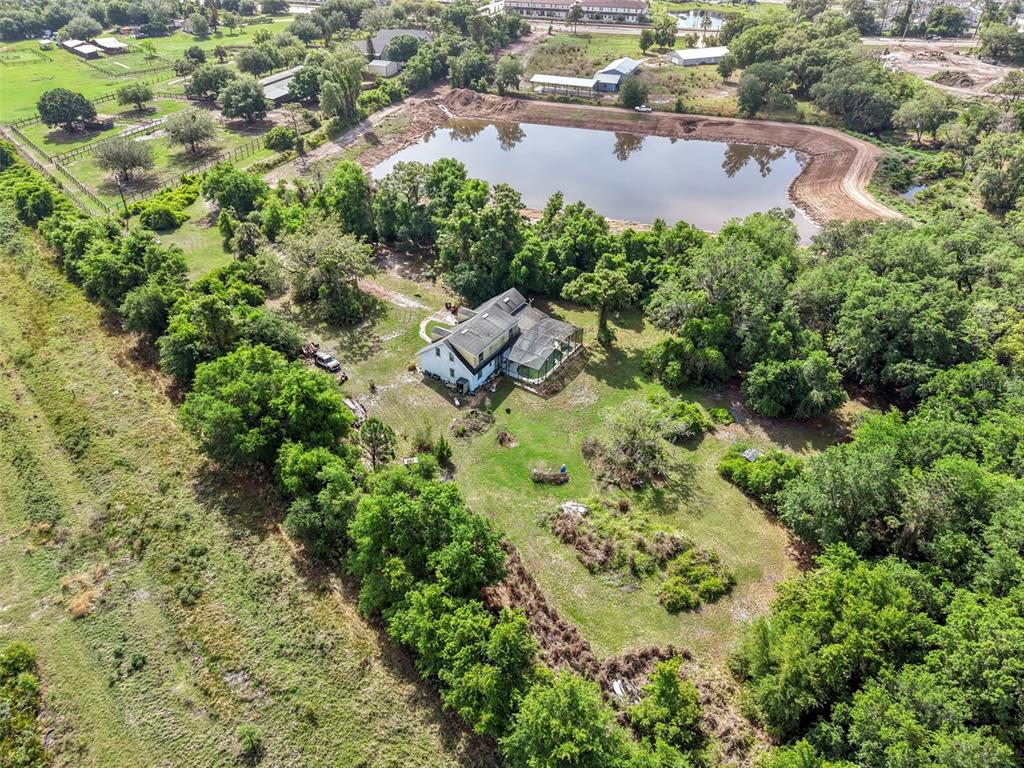 4385 Boggy Creek Road Kissimmee, FL 34744 - Photo 4 of 23 an aerial view of a house with a yard and lake view