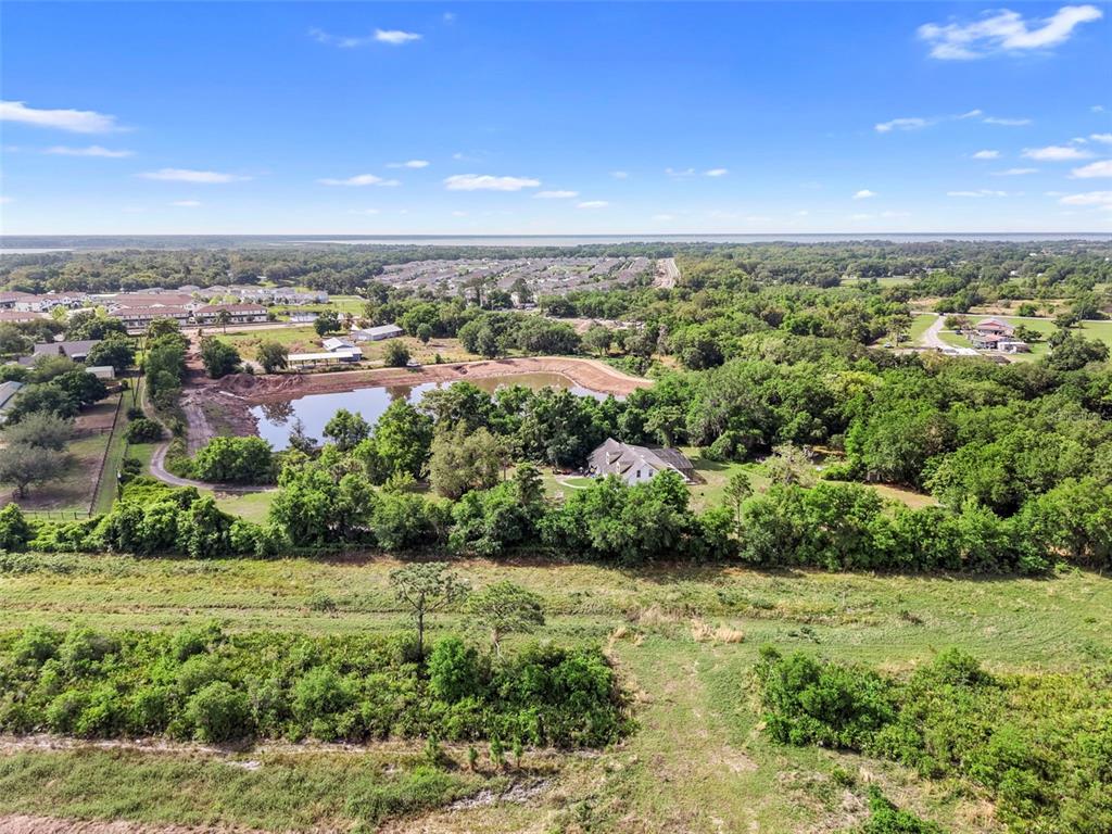 4385 Boggy Creek Road Kissimmee, FL 34744 - Photo 9 of 23 an aerial view of residential houses with outdoor space and trees