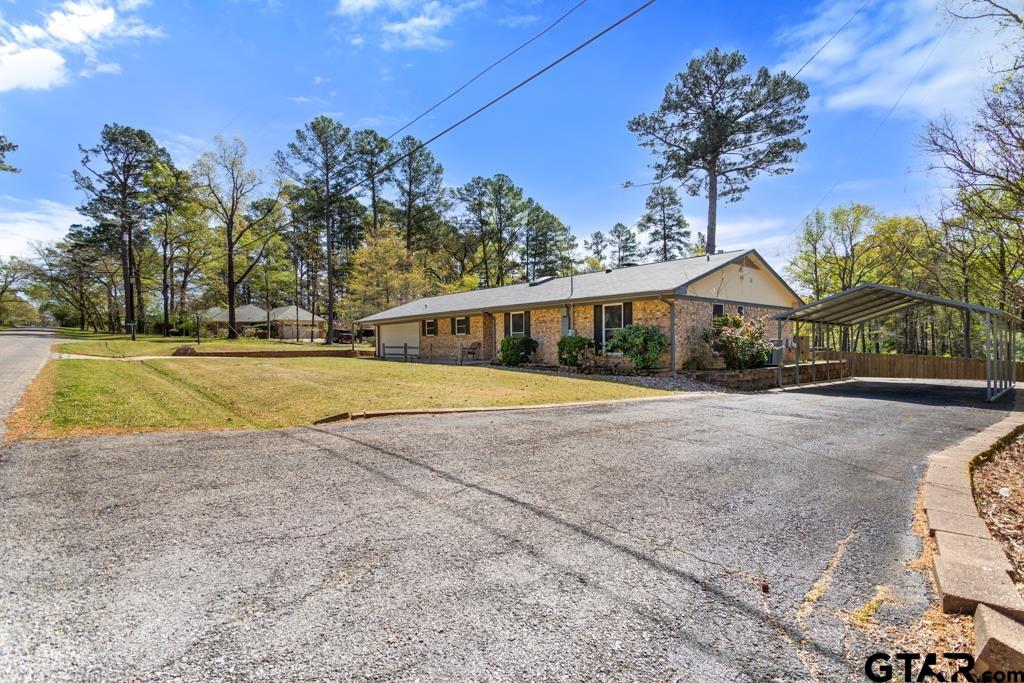 a view of swimming pool in front of house