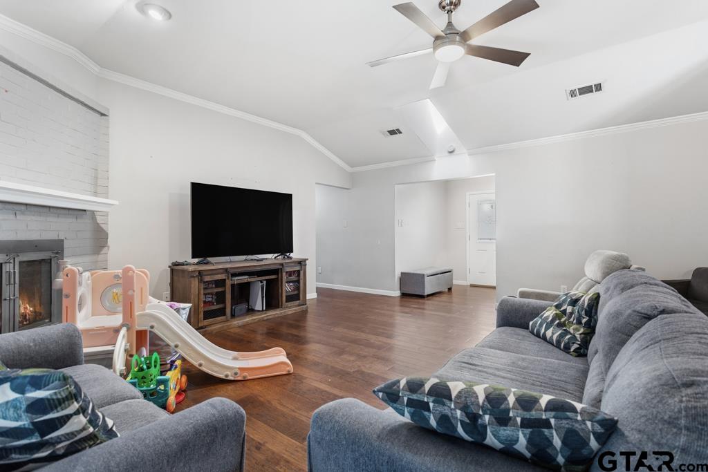 1302 Lake Cross Road Hideaway, TX 75771 - Photo 12 of 31 a living room with furniture and a flat screen tv