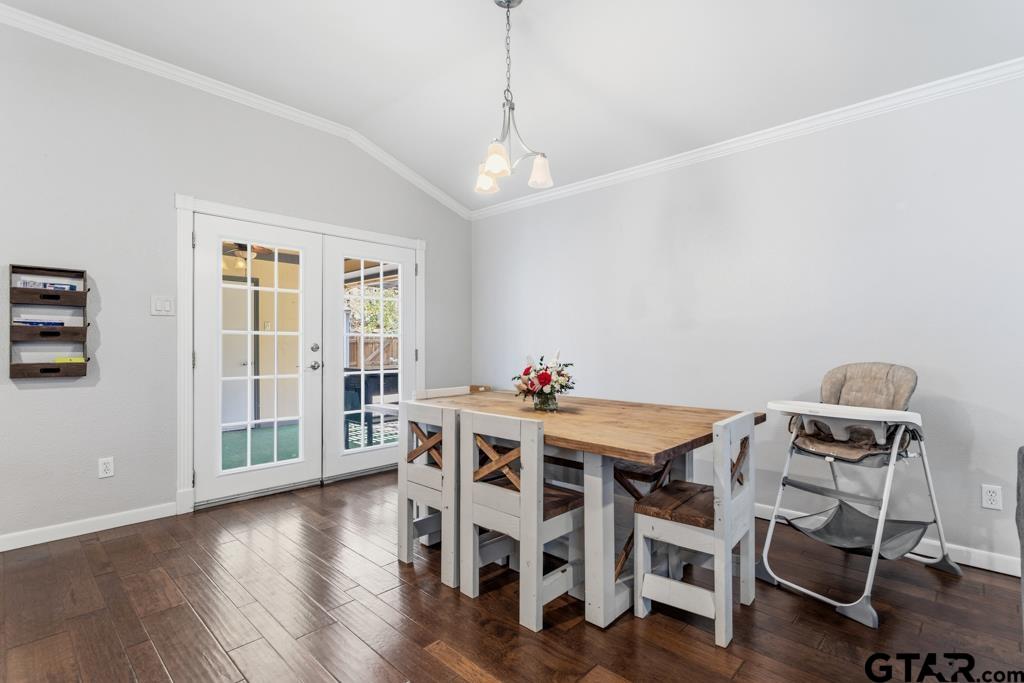 1302 Lake Cross Road Hideaway, TX 75771 - Photo 13 of 31 a view of a dining room with furniture window and wooden floor