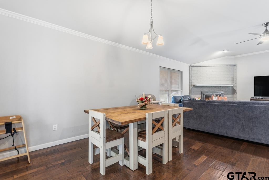 1302 Lake Cross Road Hideaway, TX 75771 - Photo 14 of 31 a view of a dining room with furniture and wooden floor