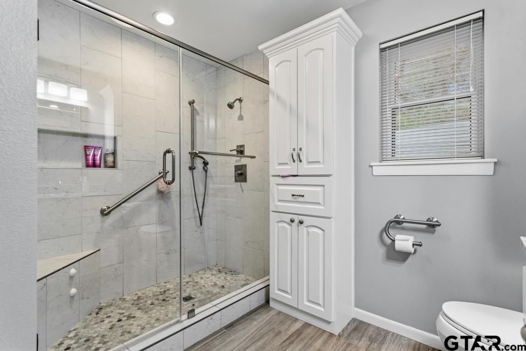 1302 Lake Cross Road Hideaway, TX 75771 - Photo 2 of 31 a bathroom with a shower