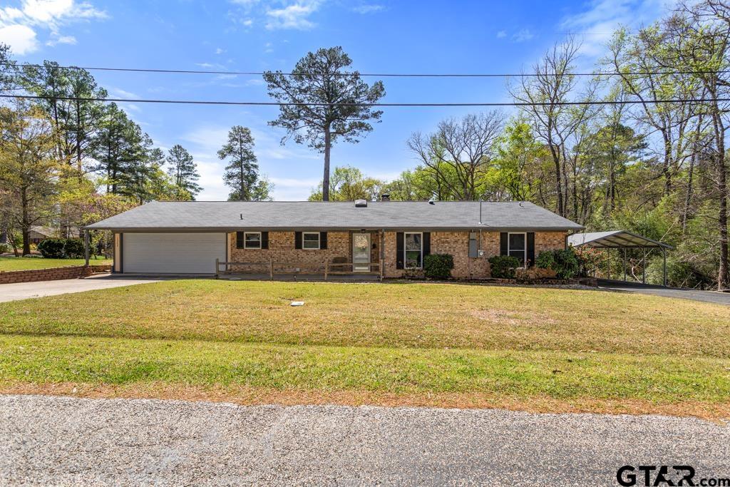 1302 Lake Cross Road Hideaway, TX 75771 - Photo 26 of 31 a front view of a house with a swimming pool