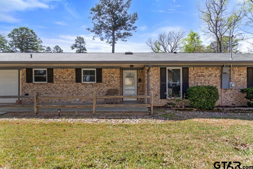 1302 Lake Cross Road Hideaway, TX 75771 - Photo 28 of 31 a view of a house with a tub and couches chair