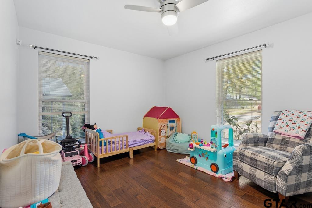 1302 Lake Cross Road Hideaway, TX 75771 - Photo 30 of 31 a bedroom with furniture and a wooden floor