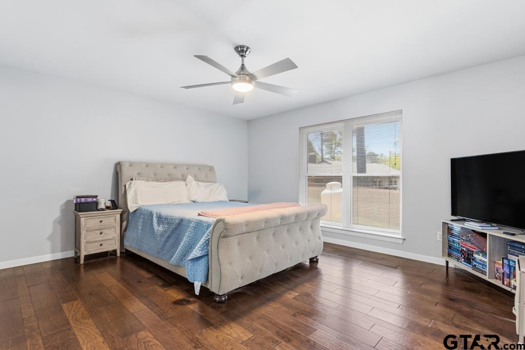 1302 Lake Cross Road Hideaway, TX 75771 - Photo 4 of 31 a bedroom with a bed and a flat screen tv