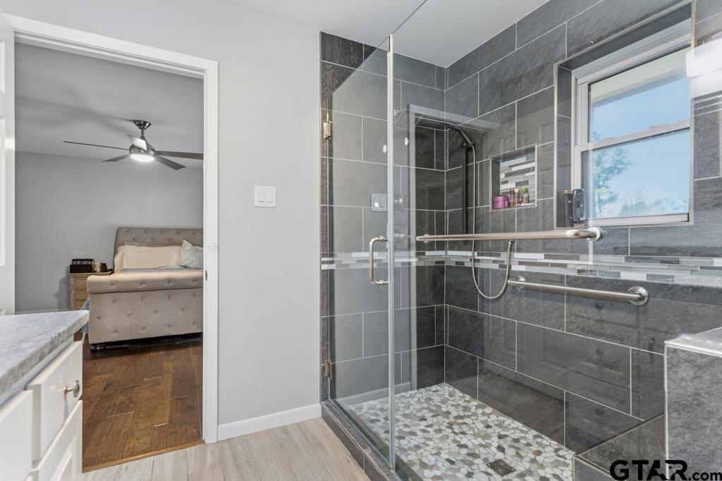 1302 Lake Cross Road Hideaway, TX 75771 - Photo 8 of 31 a bathroom with a sink toilet and shower