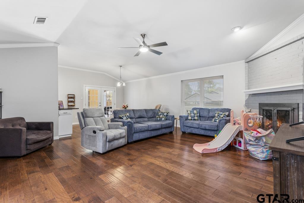 1302 Lake Cross Road Hideaway, TX 75771 - Photo 9 of 31 a living room with furniture and a wooden floor