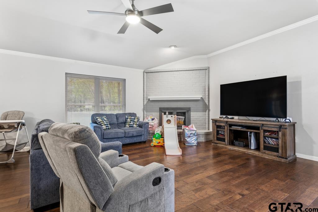1302 Lake Cross Road Hideaway, TX 75771 - Photo 10 of 31 a living room with furniture and a flat screen tv