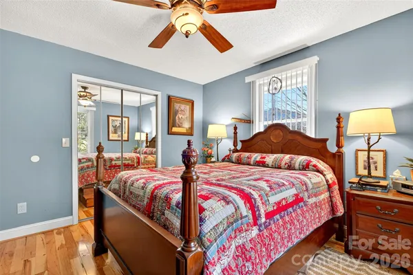 a bedroom with bed and window