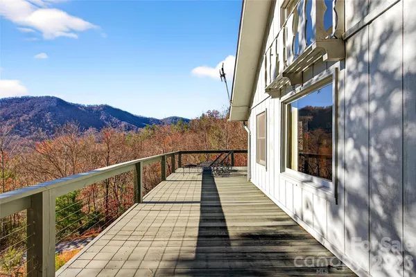 a view of a balcony with wooden floor and stairs