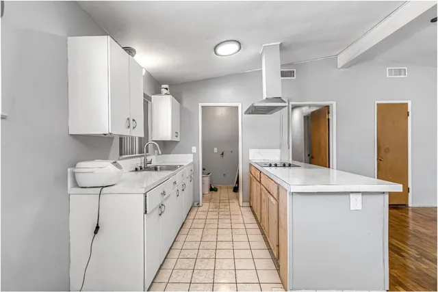a kitchen with a sink stove and refrigerator