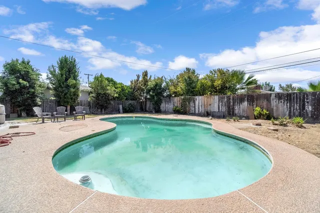 a view of a swimming pool with a patio